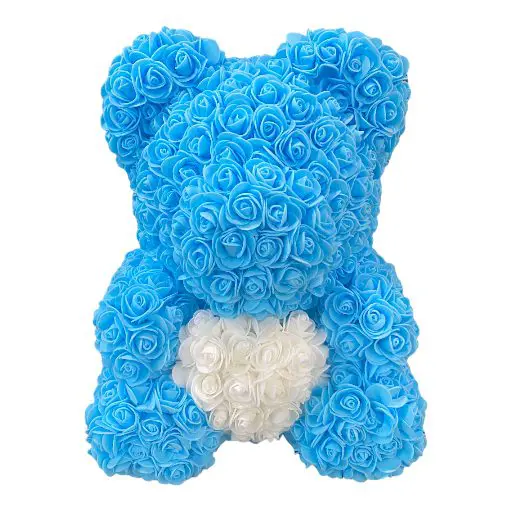 A small bear made of light blue and white roses
