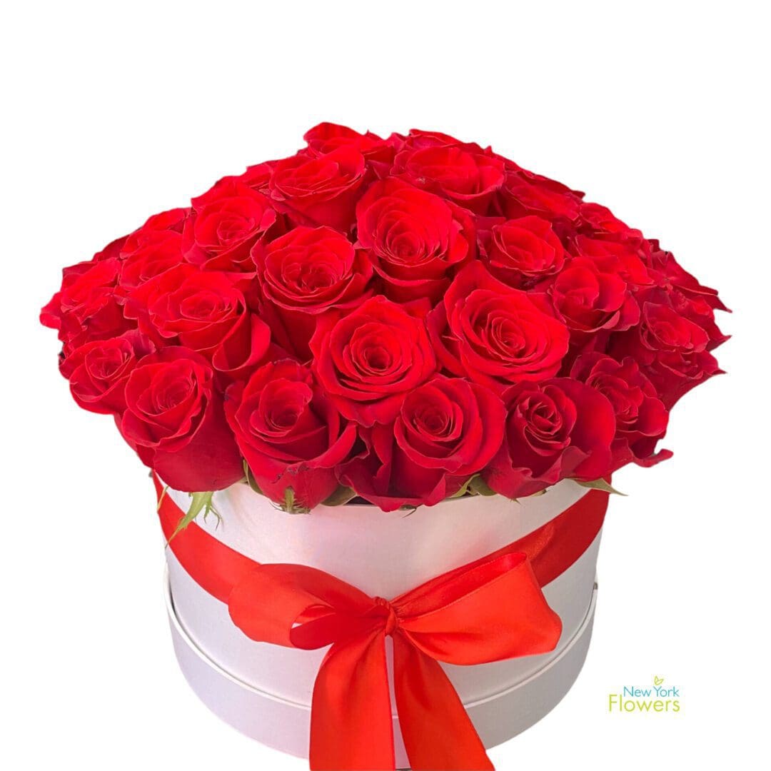 A white gift box with red roses