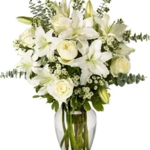 A bouquet of white roses, lilies, and daisies