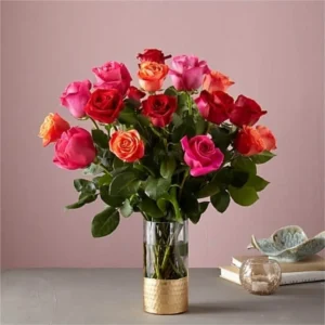 A glass vase with a bunch of roses