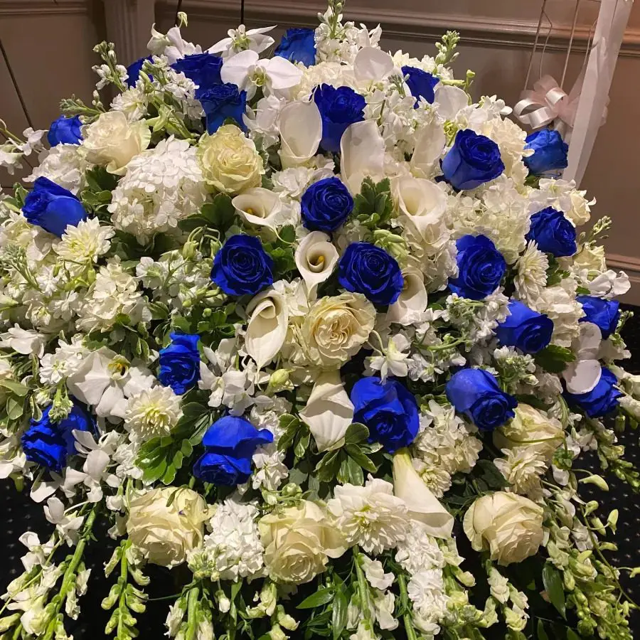 A bundle of white and blue roses