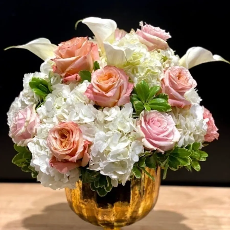 A bundle of pink roses and white flowers
