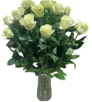 A glass vase with white roses