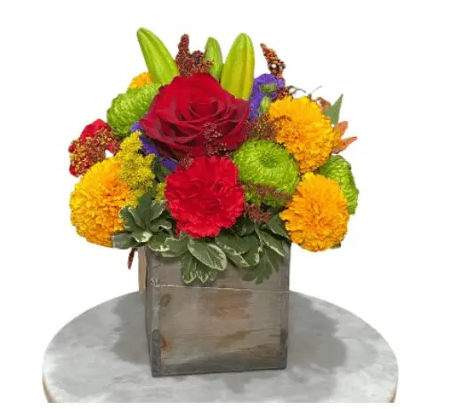 A tall vase with colorful flowers