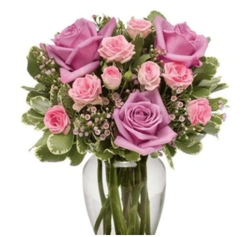 Pink and purple roses in a glass vase