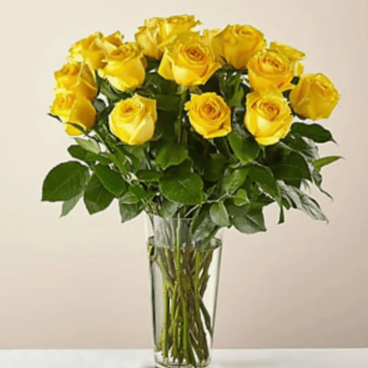 Yellow roses in a glass vase