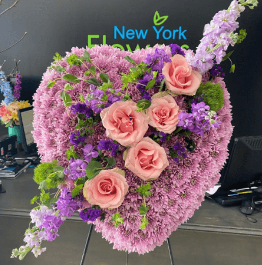 A heart made of pink and purple flowers