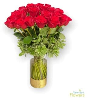 A glass vase full of red roses