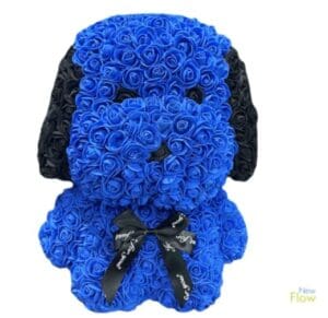 A puppy made of blue and black roses