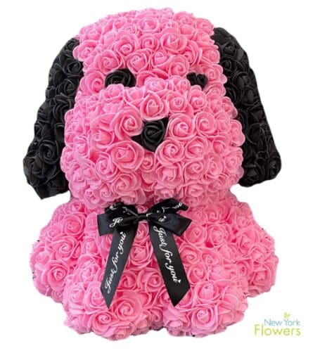 A puppy made of pink and black roses