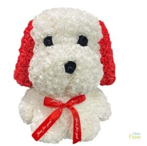 A puppy made of white, black, and red roses