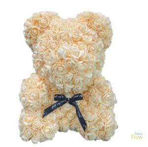 A bear made of cream roses