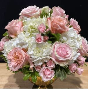 A bouquet of light pink and white roses