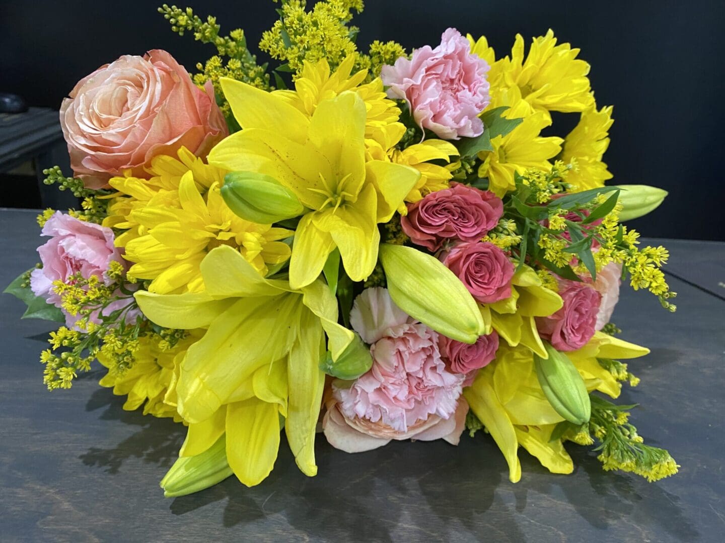 A bouquet of pink and yellow flowers