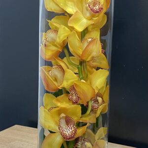 A vase with yellow orchids