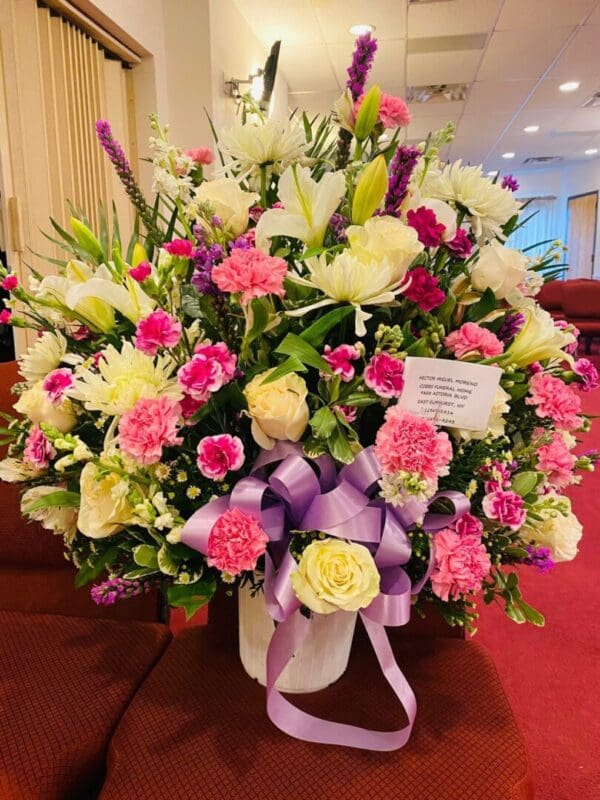 Pink and white flowers in a white vase