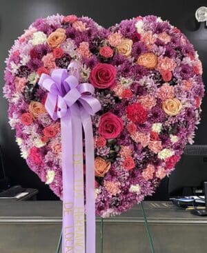 A heart made of pink and purple flowers