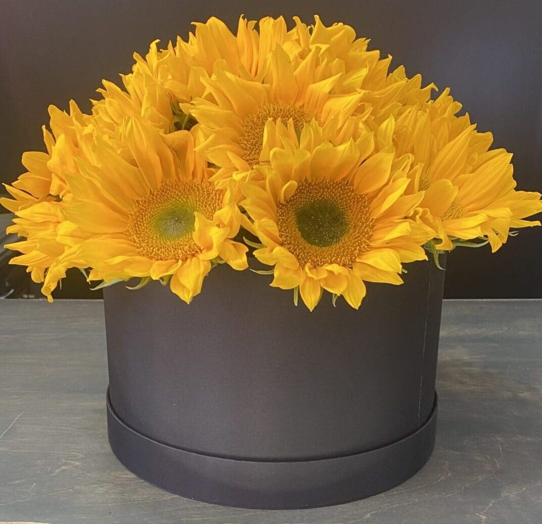 A gift box with yellow flowers