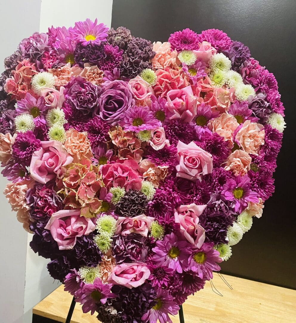 A heart made of purple and pink flowers