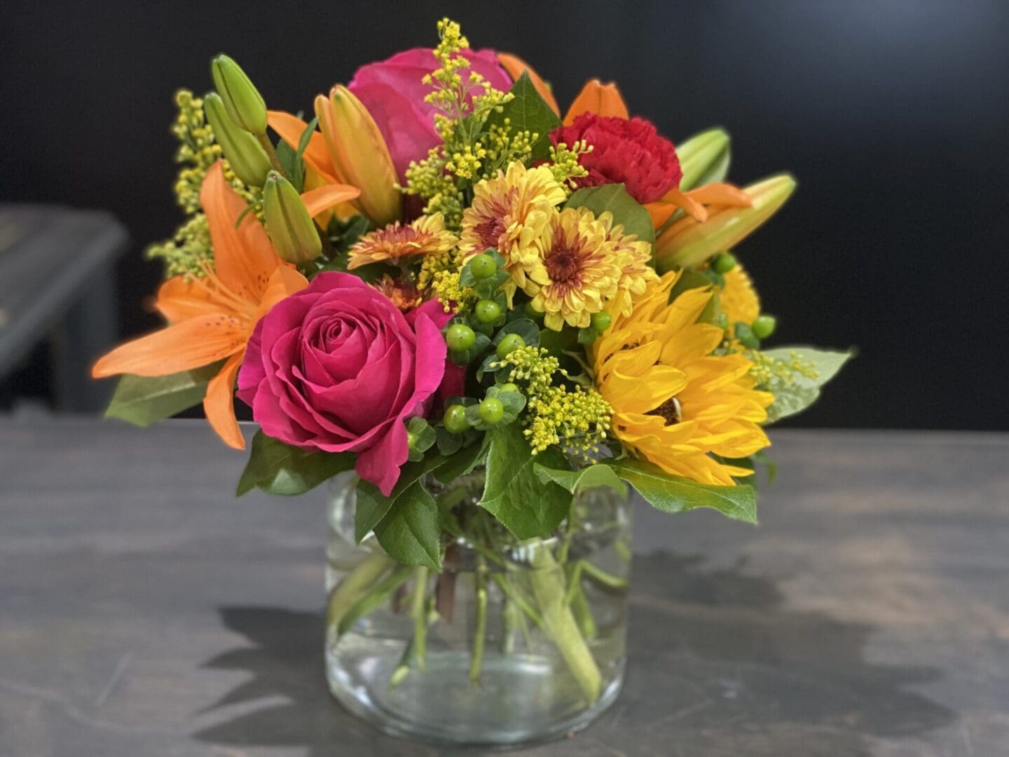 A small bouquet of pink, yellow, and orange flowers