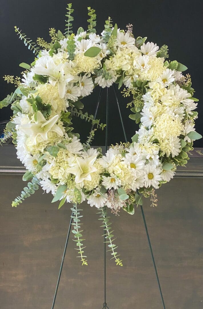 A wreath made of white and yellow flowers