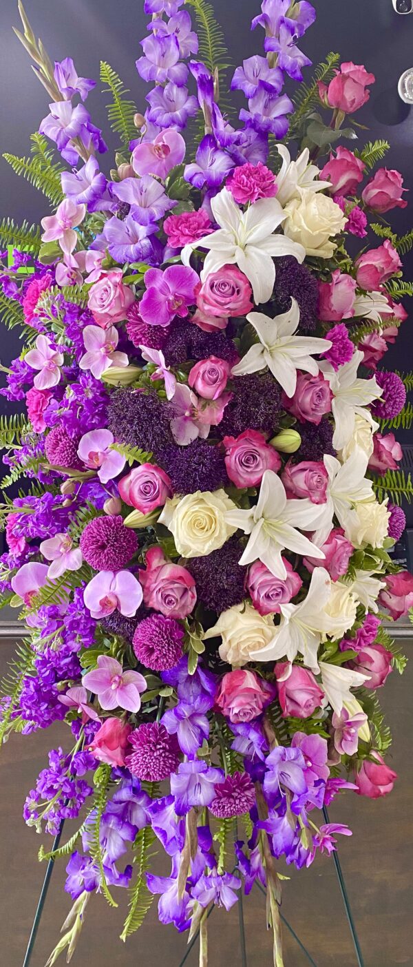 A stand with purple and white flowers