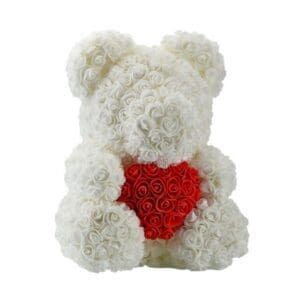 A white rose bear with a red heart