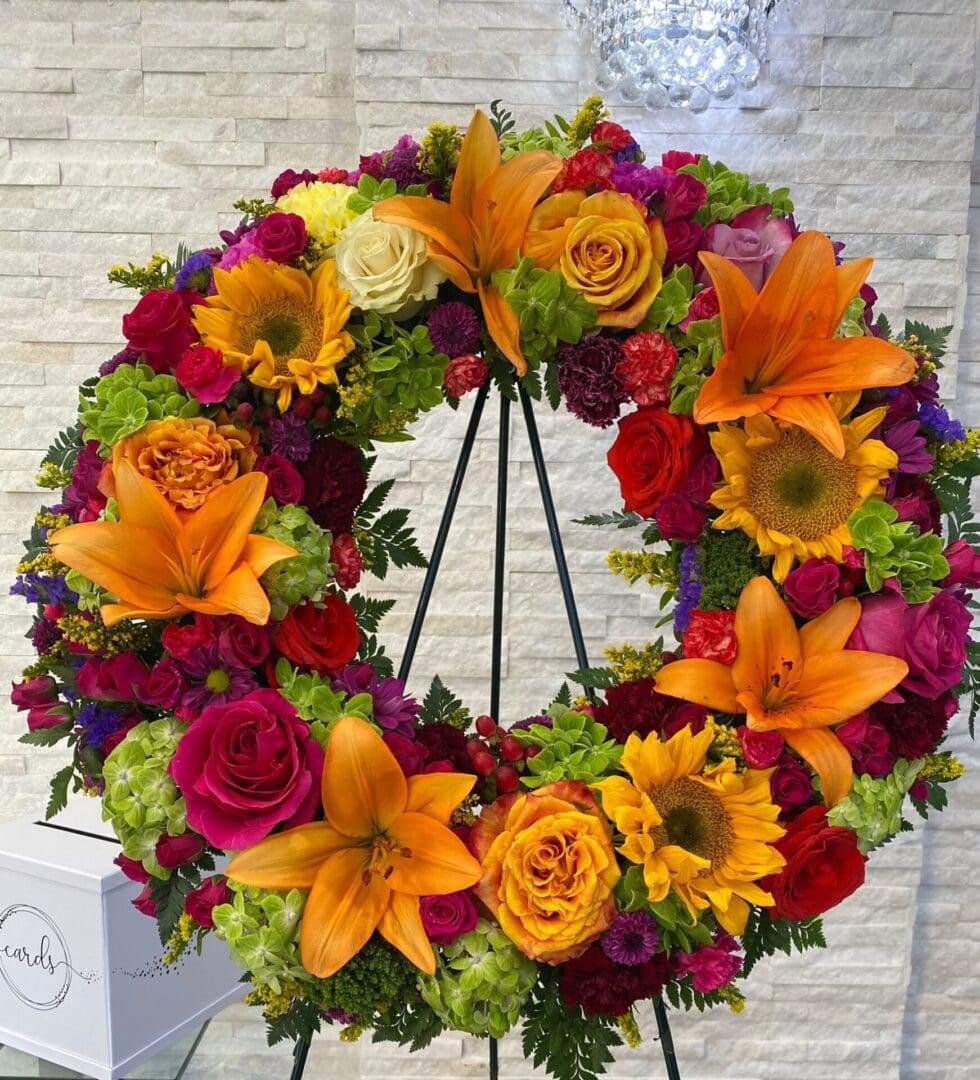 A wreath made of warm-colored flowers
