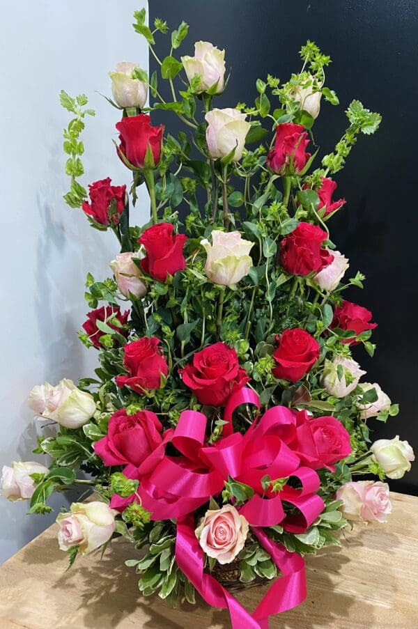 A bunch of pink roses and green stems