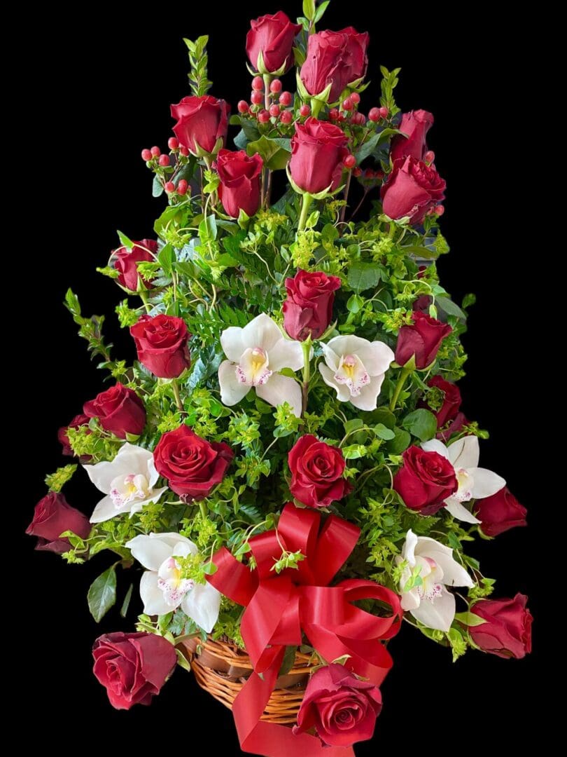 A bouquet of red and white flowers on a black background