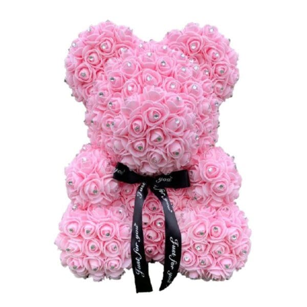 A light pink rose bear with diamonds