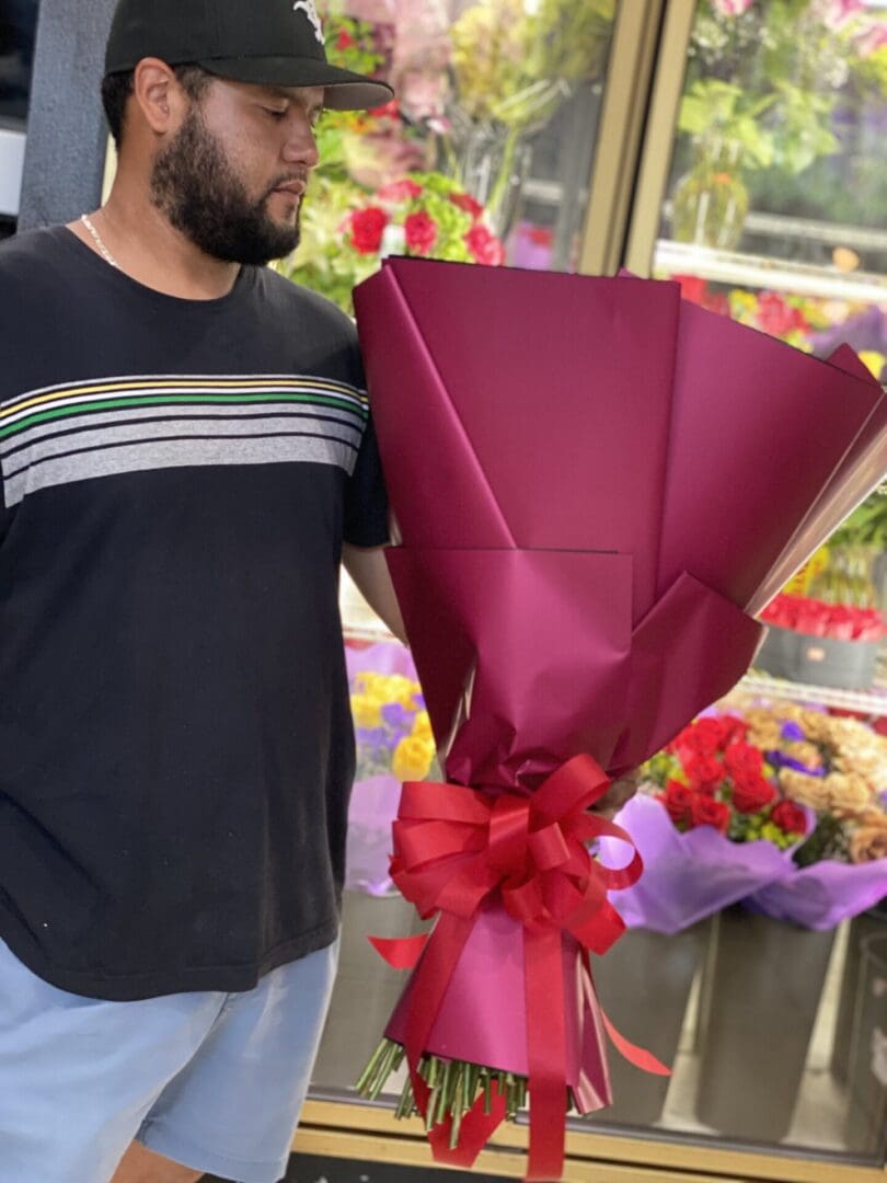 A man holding a big bouquet