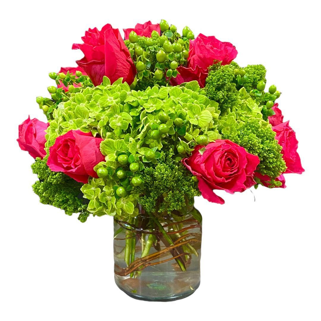 A glass vase with pink roses and green flowers