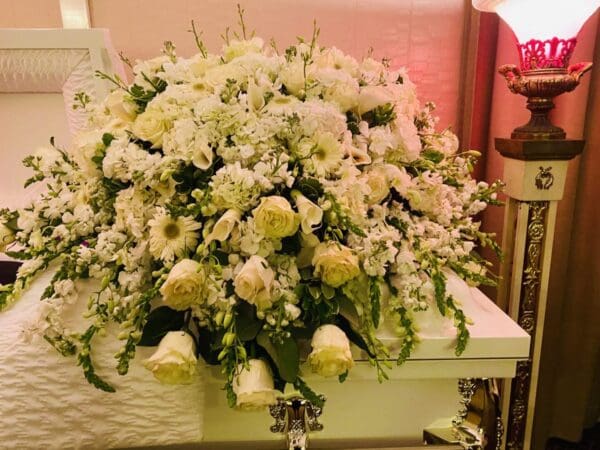 Premium White Casket with white roses