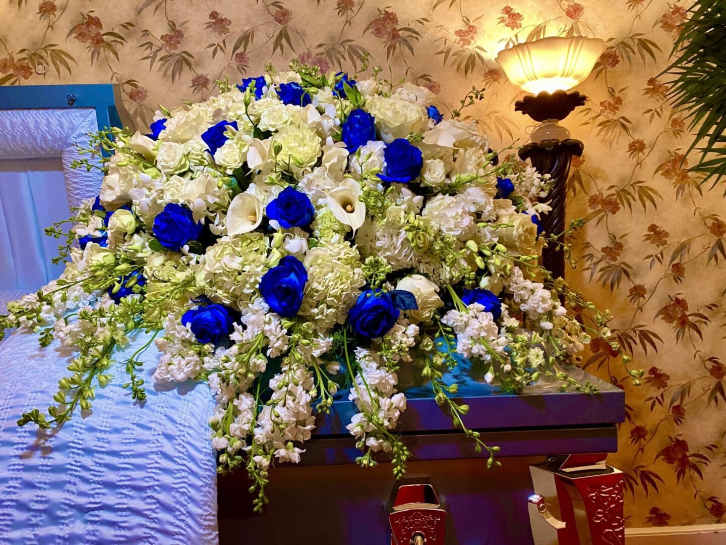 Blue Sky Casket and White Flowers