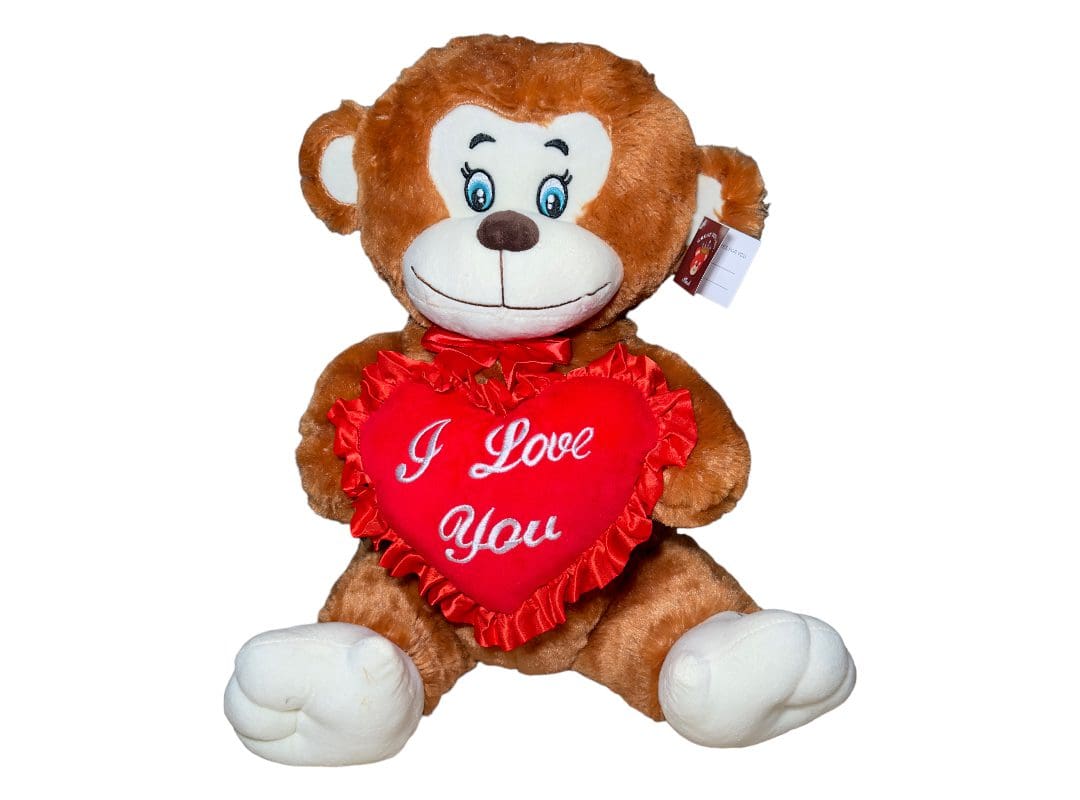 Plush teddy bear holding a red heart with the text "i love you.