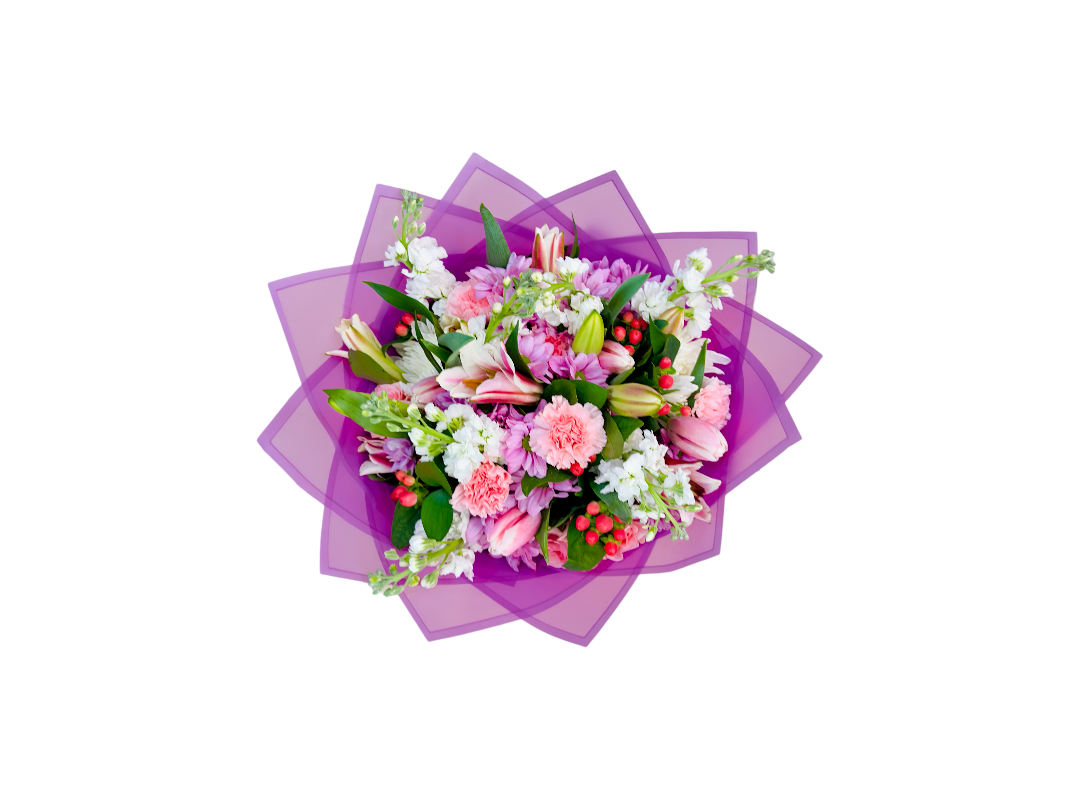 A Beautiful bouquet in pink wrapping paper viewed from above.