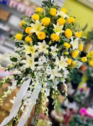 Yellow Roses and Lily Standing Spray