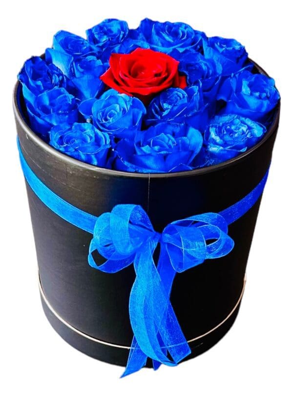 The Black Box-Blue Roses features a single red rose in the center, adorned with a blue ribbon.
