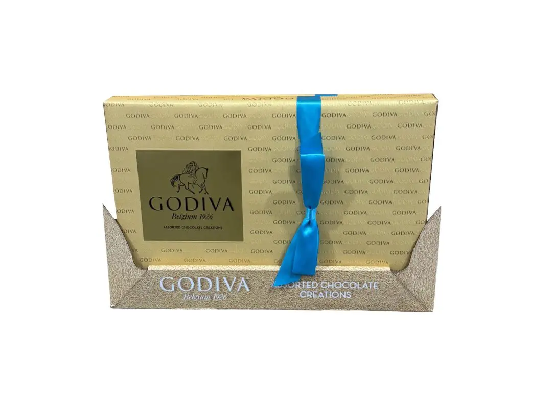 Gold and blue boxed godiva assorted chocolate creations.