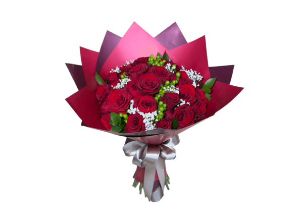 Bouquet of red roses with white accents wrapped in red paper with a silver ribbon.